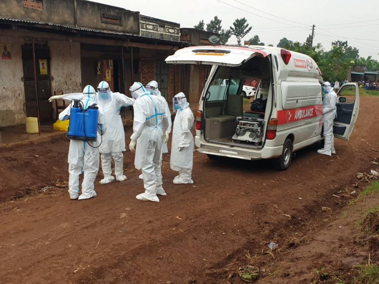 Covid-19 taskforce officials pick a body. Covid-19 taskforce officials pick a body.